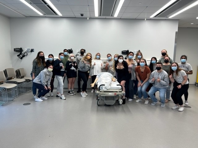 A group of undergraduate nursing students in the new simulation center in the Health Sciences Building.